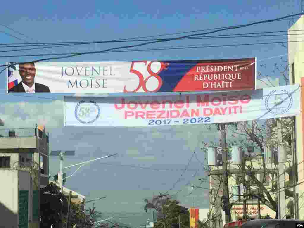 Banner celebrating Jovenel Moise's inauguration is seen on street of Port-au-Prince, Haiti's capital, Feb. 7, 2017. (Photo: VOA Creole Service)