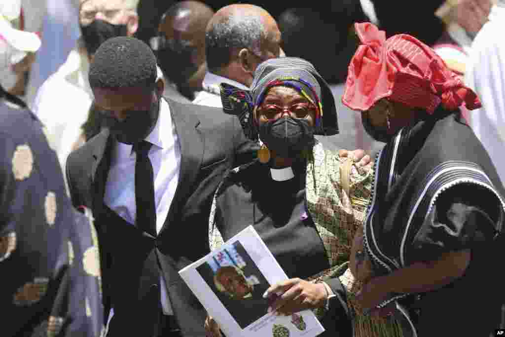 Tutu&#39;s family members are seen outside the cathedral at the end of the funeral service for Anglican Archbishop Emeritus Desmond Tutu at St. George&#39;s Cathedral in Cape Town, South Africa, Jan. 1, 2022.