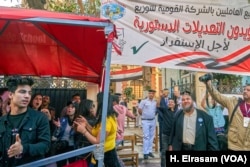 Some students said they were paid to stand at the polls for the day to boost the appearance of the turnout on April 20, 2019 in Cairo.