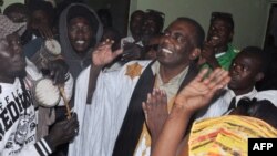 FILE - In this May 2016 photo, Mauritania anti-slavery activist Biram Ould Dah Ould Abeid (C) is welcomed by supporters after the country's supreme court downgraded the crimes he and others were convicted of in 2015 and ordered their release.