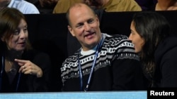 FILE - Actor Woody Harrelson watches Serbia's Novak Djokovic during the final against Great Britain's Andy Murray during Barclays ATP World Tour Finals in London, England.