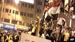 An image grab taken from a video on YouTube on April 19, 2011, shows Syrian anti-regime protesters gathered in the city of Homs. The authenticity of the video could not be independently confirmed.