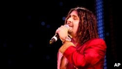 FILE - Indian Bollywood singer Sonu Nigam performed at The Asian Awards at Grosvenor House Hotel, Park Lane, London, Oct. 26, 2010. Five Jet Airways crew were suspended after allowing Nigam to sing on their flight.