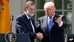 President Donald Trump shakes hands with Spanish Prime Minister Mariano Rajoy at the conclusion of a news conference in the Rose Garden of the White House, Sept. 26, 2017, in Washington. 