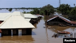 FILE - Houses partially submerged in flood waters are pictured in Lokoja city, Kogi State, Nigeria Sept. 17, 2018. 