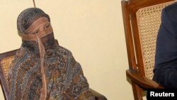 FILE - Pakistani Christian woman Asia Bibi is seen after a meeting with the governor of the Punjab Province at a jail in Sheikhupura, Pakistan.