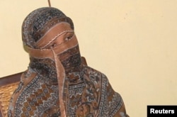 FILE - Pakistani Christian woman Asia Bibi is seen after a meeting with the governor of Punjab province at a jail in Sheikhupura, Pakistan.