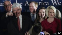 Republican presidential candidate and former House Speaker Newt Gingrich arrives with his wife Callista during his South Carolina primary rally in Columbia, South Carolina. January 21, 2012.