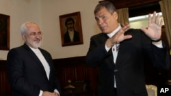 Iranian Foreign Minister Mohammad Javad Zarif, left, and Ecuador's President Rafael Correa, visit together at government palace in Quito, Ecuador, Aug. 24, 2016. 