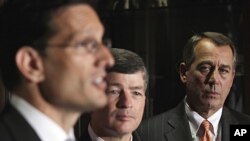 House Speaker John Boehner, right, and Republican Conference Chairman Representative Jeb Hensarling, center, listen as House Majority Leader Eric Cantor, left, speaks during a news conference on Capitol Hill in Washington, July 26, 2011