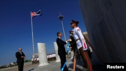 Britain's Foreign Secretary Philip Hammond (C) attends a wreath laying ceremony for Cuba's independence hero Jose Marti at Revolution Square in Havana, April 28, 2016.