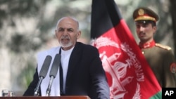 FILE - Afghan President Ashraf Ghani Ahmadzai talks during a joint news conference in Kabul, Oct. 3, 2014.