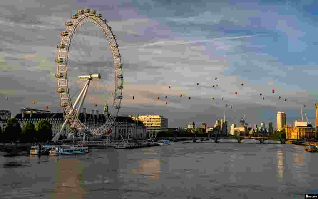 Hot air balloons fly over London as a part of the Lord Mayor&#39;s Hot Air Balloon Regatta, London, in this image obtained from social media.