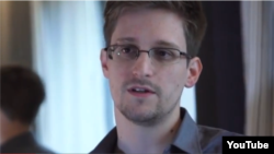 NSA whistleblower Edward Snowden giving an interview about why he leaked intelligence information. 