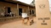 FILE - A sign for Ghana's Electoral Commission is seen at a polling station in Accra during a previous poll.