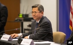 FILE - Zheng Zeguang, Chinese assistant minister of foreign affairs, speaks at a news conference in Chicago, Dec. 18, 2014.