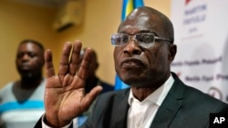 Opposition candidate Martin Fayulu speaks to the press at his headquarters in Kinshasa, Congo, Jan. 10, 2019. Fayulu, who came second in the presidential poll behind Felix Tshisekedi, called the results fraudulent.