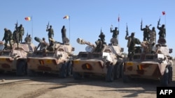 Chadian soldiers gathered near the Nigerian town of Gamboru, just across the border from Cameroon, to conduct cleanup operations after retaking the town from Boko Haram militants, Feb. 1, 2015.