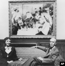 Marjorie and Duncan Phillips in front of Renoir's 'Luncheon of the Boating Party' (1880-81), ca. 1954.