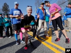Boston Marathon bombing survivor Adrianne Haslet, center, is seen in Hopkinton, Massachusetts, before running in the 120th Boston Marathon.