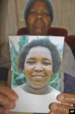 Masentle Mohajane holds a picture of her daughter, Johanna, who died, she says, after state medical staff failed to give ARVs to the HIV infected woman