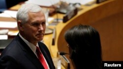 U.S. Vice President Mike Pence and U.S. Ambassador to the United Nations Nikki Haley stand before the start of a U.N. Security Council meeting on peacekeeping at the 72nd U.N. General Assembly at U.N. headquarters in New York, Sept. 20, 2017. 