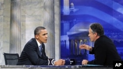 President Barack Obama talks with host Jon Stewart as he takes part in a taping of Comedy Central's The Daily Show with Jon Stewart, 27 Oct 2010, in Washington