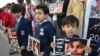 پشاور اسکول حملے میں ہلاک ہونے والوں کی یاد میں ریلیوں کا انعقاد
