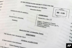 The Grand Jury Indictment against Julian Assange, released by the U.S. Department of Justice, April 11, 2019, is photographed in Washington.