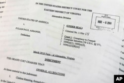 The grand jury indictment against Julian Assange, released by the U.S. Department of Justice, April 11, 2019, is photographed in Washington.