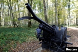 A damaged cannon is on display in the middle of Belleau Wood behind the Aisne-Marne American Cemetery dedicated to the U.S. soldiers killed in the Belleau Wood battle during the World War I at Belleau, France, Nov. 6, 2018.