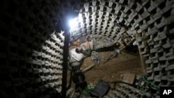 A Palestinian worker takes a break from working on a smuggling tunnel between Egypt's Sinai and the Gaza Strip.