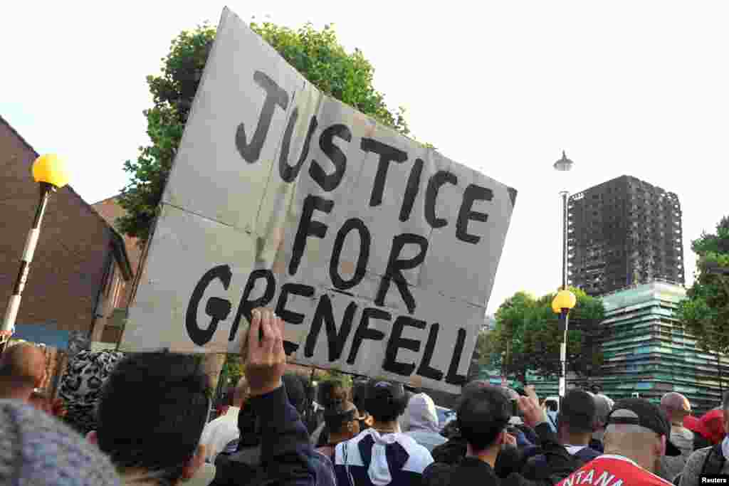 Protesters march towards The Grenfell Tower block that was destroyed by fire, in north Kensington, West London, Britain.