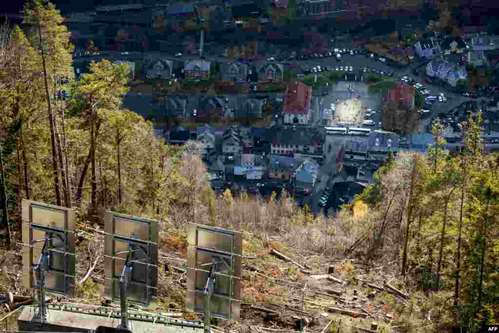 The huge sun mirrors ("Solspeilet") set up on the hillside above Rjukan, Norway to reflect sunlight down on the town square, are seen during the official inauguration. Sun-starved residents of the remote Norwegian village unveiled an ingenious mirror system to bring natural light to their mountain valley home, enveloped in darkness for half the year.