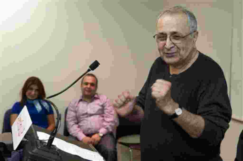 Reza Taghavi answers questions as his daughter Leila, left, and son Nima look on at Los Angeles International Airport upon his return after being detained in Iran for more than two years, Thursday, Oct. 21, 2010, in Los Angeles. (AP Photo/Mark J. Terrill)