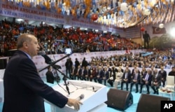 FILE - Turkey's President Recep Tayyip Erdogan addresses members of his ruling party in Ordu, Turkey, March 24, 2018. Erdogan has criticized anti-war students at Bosphorus University, calling them terrorists following a fight there.