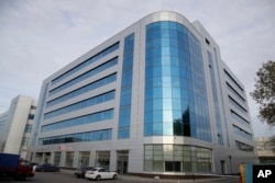 FILE - A business center building known as the "troll factory", an Internet Research Agency, one of a web of companies allegedly controlled by Yevgeny Prigozhin, who has reported ties to Russian President Vladimir Putin, in St. Petersburg, Russia .