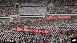 FILE - North Koreans gather at the "Pyongyang Mass Rally on the Day of the Struggle Against the U.S." to mark the 65th anniversary of the outbreak of the Korean War at the Kim Il Sung stadium, June 25, 2015, in Pyongyang, North Korea.