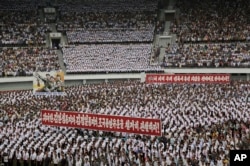 FILE - North Koreans gather at the "Pyongyang Mass Rally on the Day of the Struggle Against the U.S." to mark the 65th anniversary of the outbreak of the Korean War at the Kim Il Sung stadium, June 25, 2015, in Pyongyang, North Korea.