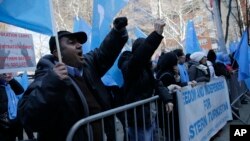 Uighurs and their supporters rally in front of the Permanent Mission of China to the United Nations in New York, March 15, 2018, to protest a sweeping crackdown against members of the ethnic minority in China.