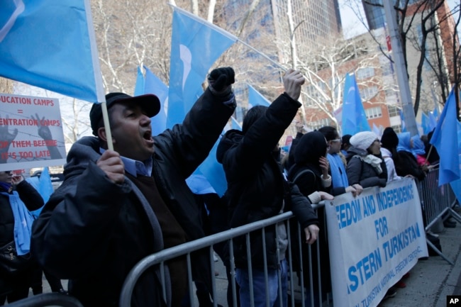 Uighurs and their supporters protest in front of the Permanent Mission of China to the United Nations in New York, March 15, 2018. Members of the Uighur Muslim ethnic group held demonstrations in cities around the world on that day to protest a sweeping Chinese surveillance and security campaign that has sent thousands of their people into detention and political indoctrination centers.