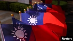 FILE - Taiwan flags can be seen at a square ahead of the national day celebration in Taoyuan, Taiwan, Oct. 8, 2021.
