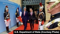 U.S. Secretary of State John Kerry, left, walks with Special Envoy for Israeli-Palestinian Negotiations Frank Lowenstein as they exit the MFA Convention Center in Paris, France, following a French-sponsored conference focused on Middle East peace efforts,