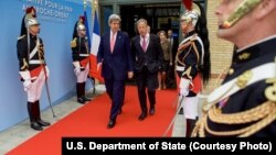 U.S. Secretary of State John Kerry, left, walks with Special Envoy for Israeli-Palestinian Negotiations Frank Lowenstein as they exit the MFA Convention Center in Paris, France, following a French-sponsored Middle East conference, June 3, 2016.