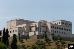 FILE - U.S. Marines stand guard on the roof of U.S. Consulate in Istanbul, July 18, 2016, during a failed coup attempt against the government of President Recep Tayyip Erdogan.