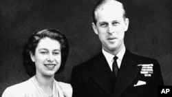 FILE - Britain's Princess Elizabeth heir to the British throne, and her fiance, Lieutenant Philip Mountbatten, July 10, 1947, announce their engagement in London.