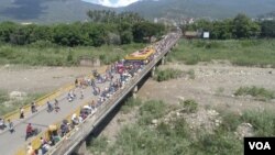Migranti iz Venecuele na granici sa Kolumbijom