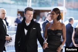 FILE - Singer David Bowie arrives with his wife, Iman, to attend the CFDA fashion awards in New York, June 7, 2010.