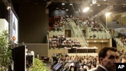 South African President Jacob Zuma, left back, speaks during the opening ceremony of the second week of climate change conference in Durban, South Africa, December 6, 2011.