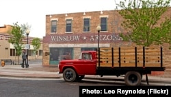 A flatbed Ford truck permanently parked at Standin' on the Corner Park, in Winslow, Arizona, as a tribute to the Eagles song 'Take it Easy,' written by Jackson Browne & Glenn Frey. 